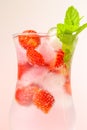 Strawberry drink.Summer drinks.Refreshing cocktail. water in glass with ice and strawberries. Mineral water with ice and Royalty Free Stock Photo