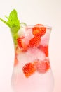 Strawberry drink.Summer drinks.Refreshing cocktail. water in glass with ice and strawberries. Mineral water with ice and Royalty Free Stock Photo