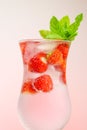 Strawberry drink.Summer drinks.Refreshing cocktail. water in glass with strawberries. Mineral water with ice and Royalty Free Stock Photo