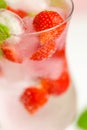 Strawberry drink.Summer drinks.Refreshing cocktail. water in with ice and strawberries. Mineral water with ice and Royalty Free Stock Photo