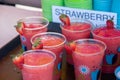 Strawberry drinks in decorated cups were sale at a booth