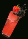 Strawberry dropped in splashing strawberry coctail Royalty Free Stock Photo