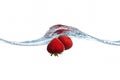 Strawberry dropped into water splash Royalty Free Stock Photo