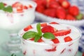 Strawberry flavored yoghurt with fresh berries and mint leaves. Royalty Free Stock Photo