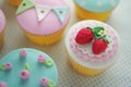 Strawberry fondant cup cakes. Royalty Free Stock Photo