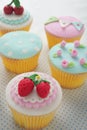 Strawberry fondant cup cakes. Royalty Free Stock Photo