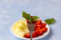 Strawberry on a fork close up. resh Organic Vegetarian Fruit Salad on a plate Royalty Free Stock Photo