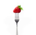 Strawberry on a fork isolated on white background Royalty Free Stock Photo