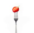Strawberry on a fork isolated on white background Royalty Free Stock Photo