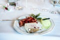 Strawberry fruit and cake and vanilla ice cream desert, served on a white plate, shallow focus