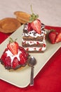 Strawberry fruit tart and chocolate strawberry cake on a plate Royalty Free Stock Photo