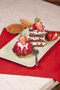 Strawberry fruit tart and chocolate strawberry cake on a plate Royalty Free Stock Photo