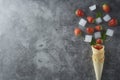 Strawberry fruits in waffle cone, over dark background, top view. Coy space Royalty Free Stock Photo