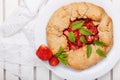 Strawberry galette. Homemade healthy wholegrain berry open pie. Fruit tart. Top view