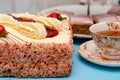 Strawberry gateau cake with fruits and cup of tea