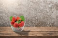 Strawberry Glass on wooden desk and grunge metal Background