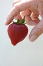 Strawberry and hand