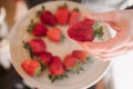 Strawberry in hand. Close up view of ripe fresh strawberries. Royalty Free Stock Photo