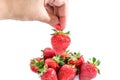 Strawberry in hand on white background