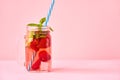 Strawberry homemade lemonade in a mason jar with copy space on pink background. Royalty Free Stock Photo