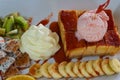 Strawberry honey Toast bread topped with ice cream, stawberry se