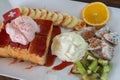 Strawberry honey Toast bread topped with ice cream, stawberry