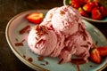 Strawberry ice cream balls served on plate