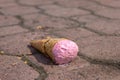 Ice cream fallen on the road, melts in the sun