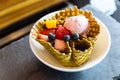 Strawberry ice cream with fresh fruits inside crispy thin waffle bowl Royalty Free Stock Photo
