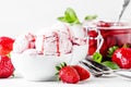 Strawberry ice cream with jam topping, decorated with green mint Royalty Free Stock Photo