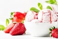 Strawberry ice cream with jam topping, decorated with green mint Royalty Free Stock Photo