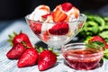 Strawberry ice cream with mint in bowl and jam Royalty Free Stock Photo