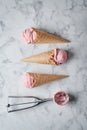 strawberry ice cream and waffle cone on marble background, top view Royalty Free Stock Photo