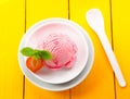 Strawberry icecream on yellow table