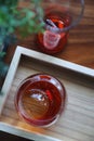 Strawberry iced tea on wooden tray