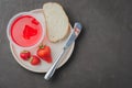 Strawberry jam. Bread and strawberry jam on a dark stone background with jar of jam and fresh strawberry. Top view. Making Royalty Free Stock Photo