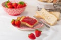 Strawberry jam, fresh strawberries and knife on a plate Royalty Free Stock Photo