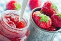 Strawberry jam in a glass jar and fresh strawberries Royalty Free Stock Photo
