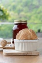 Strawberry jam in jar and fresh homemade bread on wood background Royalty Free Stock Photo