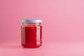 Strawberry jam jar mockup isolated on pink background Royalty Free Stock Photo