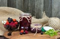 Strawberry jam in a jar on wooden background