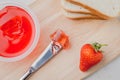 Strawberry jam. Making sandwiches with strawberry jam. Top view. Bread and strawberry jam on a white table with jar of jam and Royalty Free Stock Photo