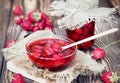 Strawberry jam marmalade jelly in bowl on wooden background. Royalty Free Stock Photo