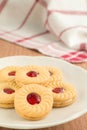Strawberry jam sandwich biscuits on plate