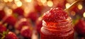 Strawberry jam. Spoon scooping homemade strawberry jam from a glass jar surrounded by fresh strawberries Royalty Free Stock Photo