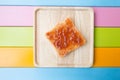 Strawberry jam spread on bread on wooden plate Royalty Free Stock Photo