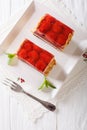 Strawberry jelly cake with almonds closeup on a plate. vertical Royalty Free Stock Photo