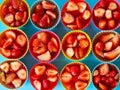 Strawberry jelly isolated on blue background. Top view