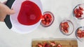 Strawberry Jelly Preparation Process. Strawberry Slices in a Glass Bowls. Pouring Jelly Mix in a Bowls. Close Up Top View on Whit Royalty Free Stock Photo