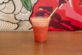 Strawberry juice slush in a plastic cup